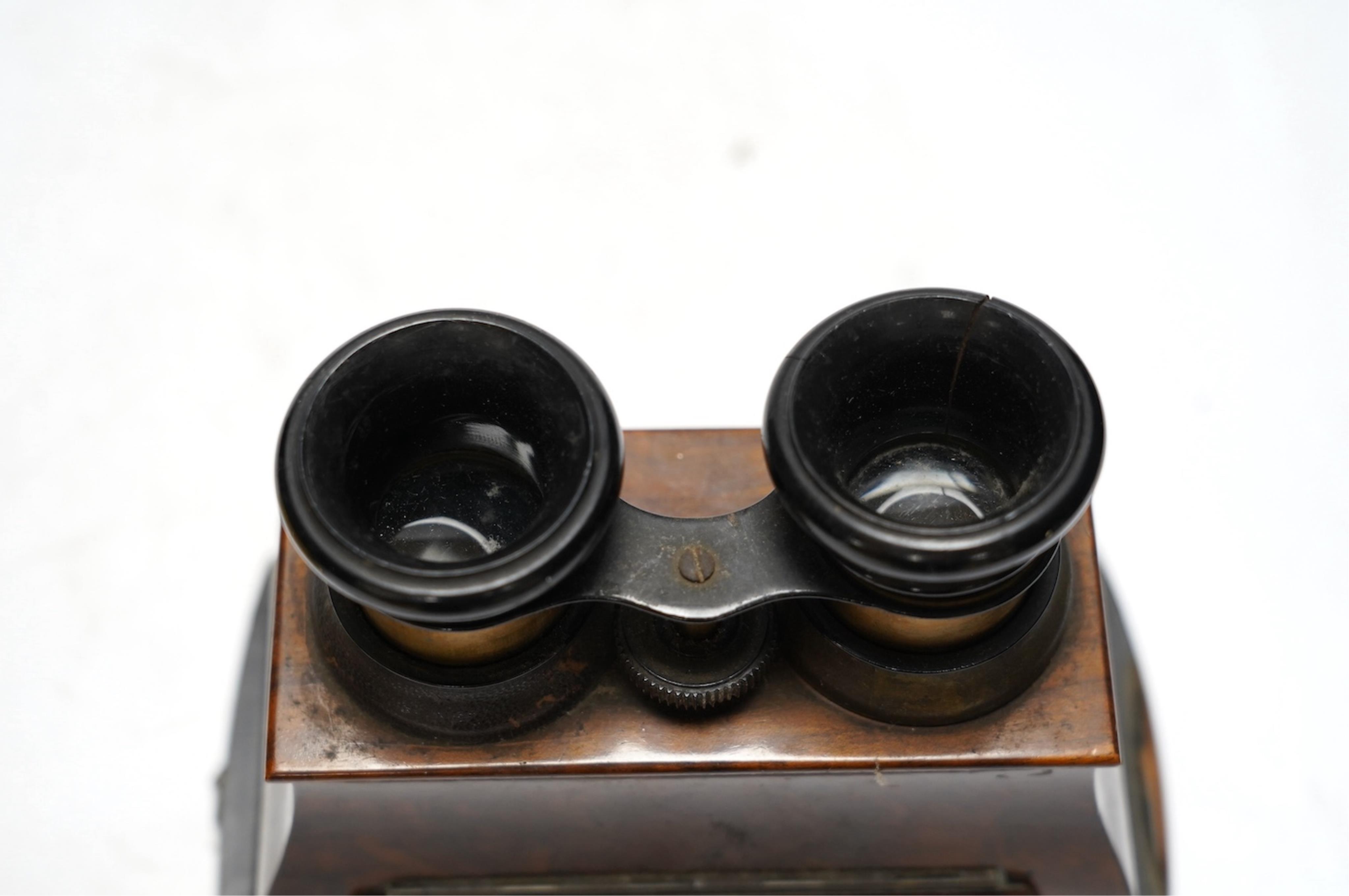 A late 19th century cased stereoscopic viewer together with topographical and other cards. Condition - fair